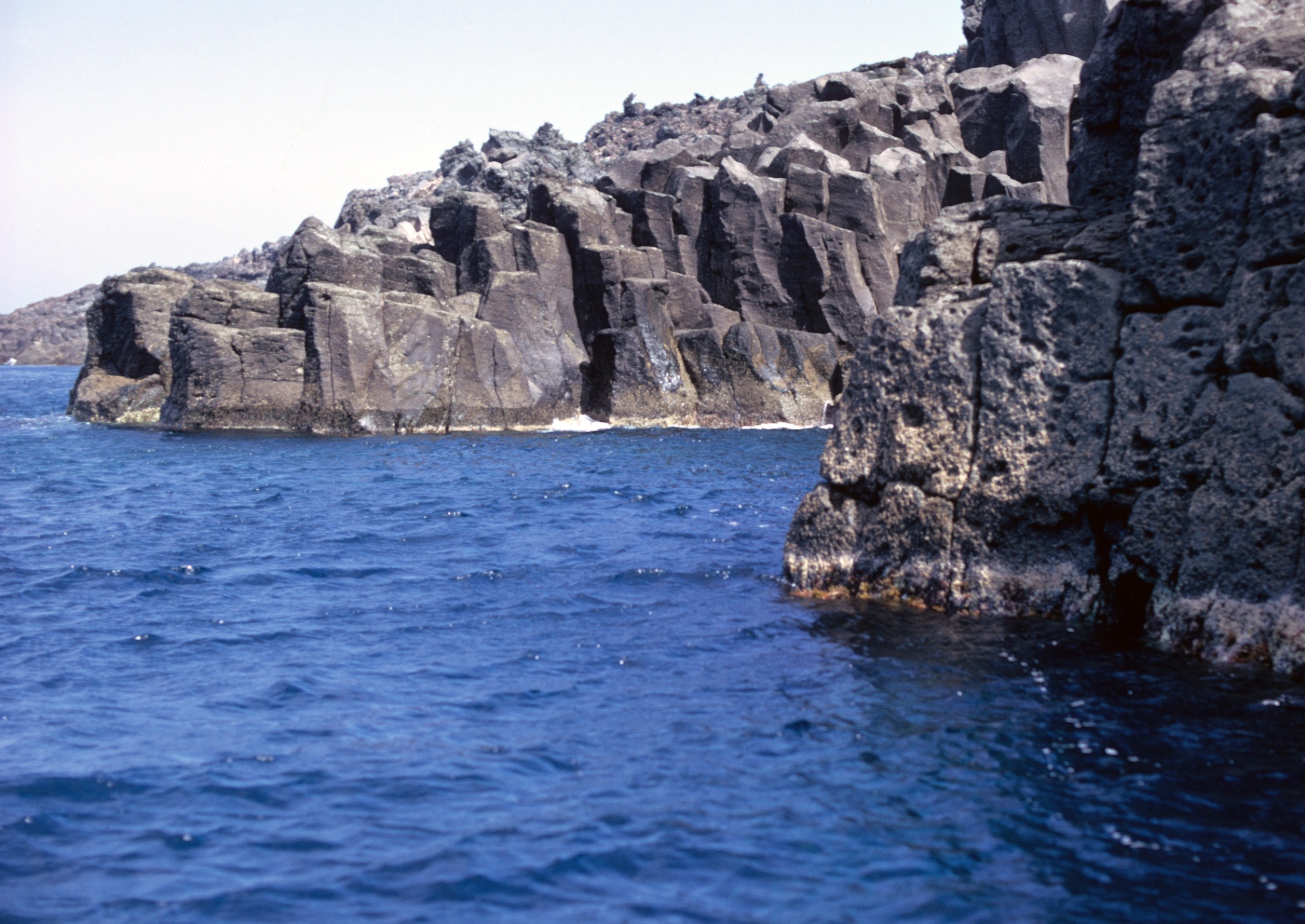 Sculptured basalt columns rising from the sea