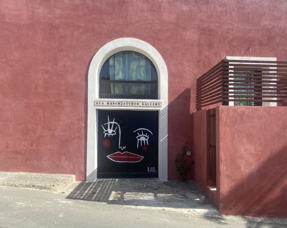 Warehouse facade from the street with arched window and painted door