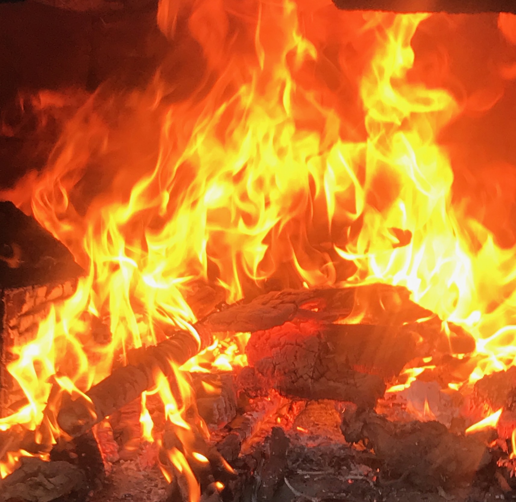 Roaring flames inside the wood-fired oven